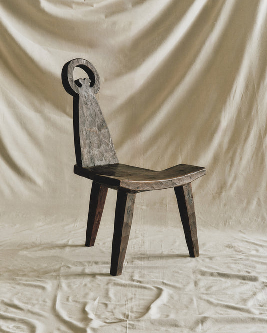 three-legged chair