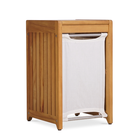 A natural teak laundry basket with a removable white canvas liner, shown with its lid closed.
