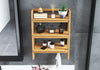 Three-tier premium teakwood bathroom shelf with round edges, holding toiletries, towels, & a plant.